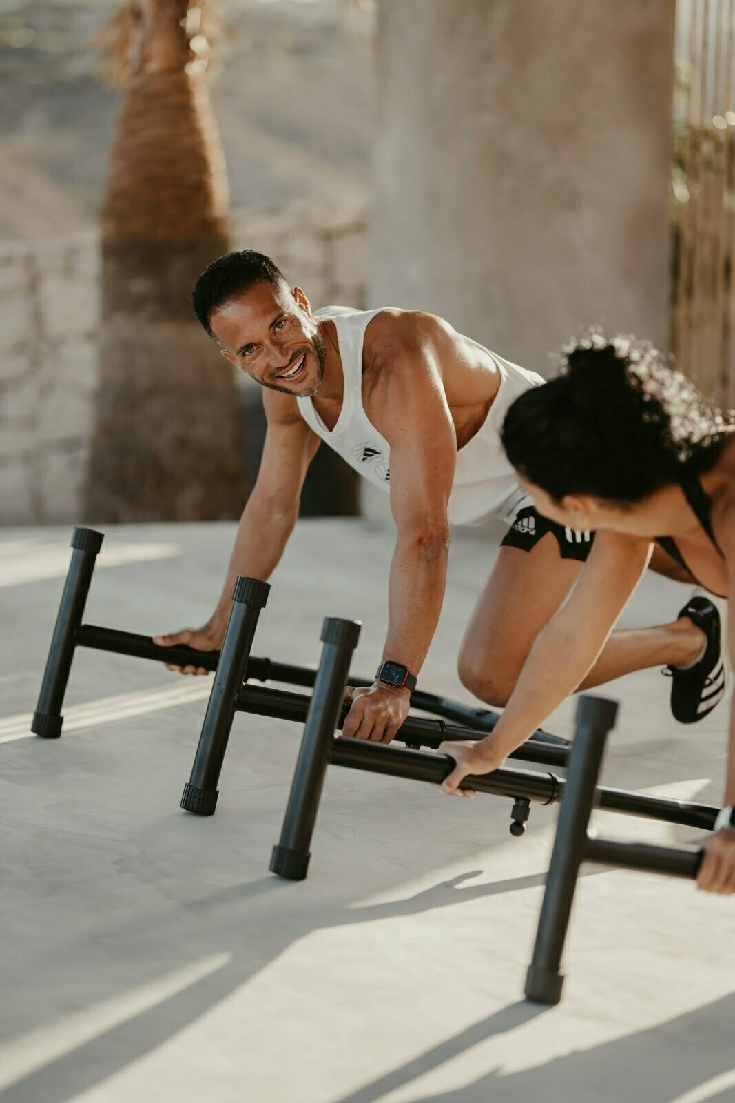 Guest training outdoors with a personal trainer